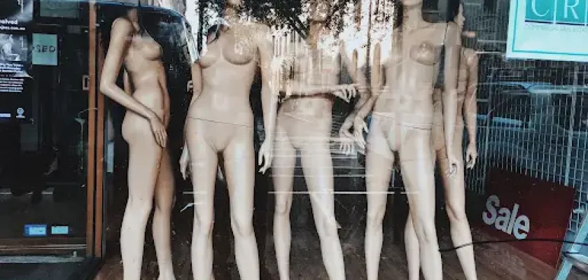 Realistic full-body mannequin in storefront